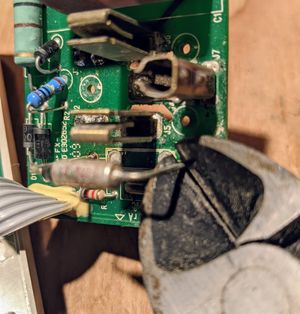 Wire cutters removing the bad fuse Snip snip!